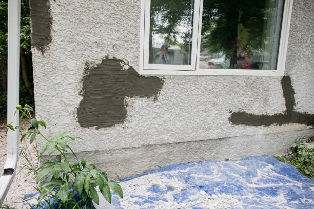 Stucco is getting replaced on the house siding in Winnipeg Manitoba Canada