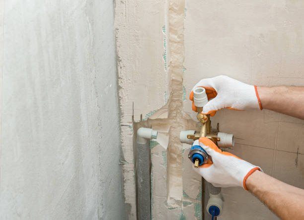 Installation of water pipes in the wall for the built-in shower.